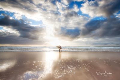 gold cloudy sunrise breaking through surfer beach gold coast
