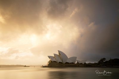 golden sunrise clouds sydney opera house