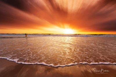 red orange sunrise surfer beach surfers paradise gold coast