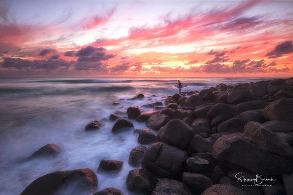 red sky sunrise surfer rocks burleigh heads gold coast