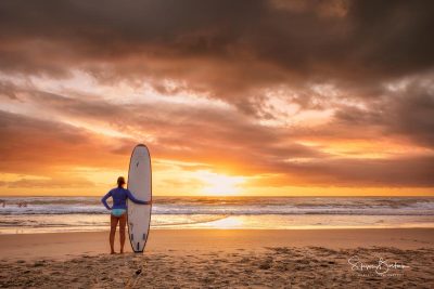surfer girl beach sunrise surfers paradise beach gold coast