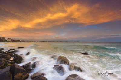 yellow sunrise rocks ocean greenmount beach gold coast